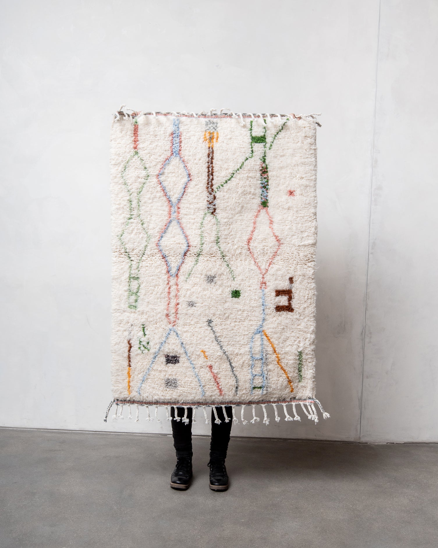 Modern, designer, handcrafted Berber rug from Morocco. Beniourain carpet with beautiful colours and patterns and fluffy wool texture.